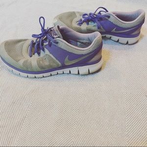 Nike purple and gray running shoes